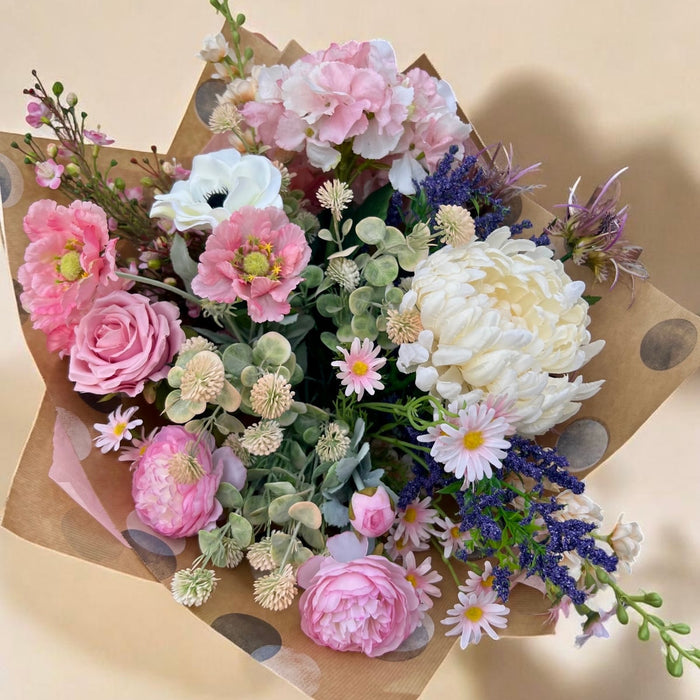 The Cottage Garden artificial bouquet with blush, ivory and soft purple flowers, supplied wrapped without a vase