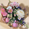 The Cottage Garden artificial bouquet with blush, ivory and soft purple flowers, supplied wrapped without a vase
