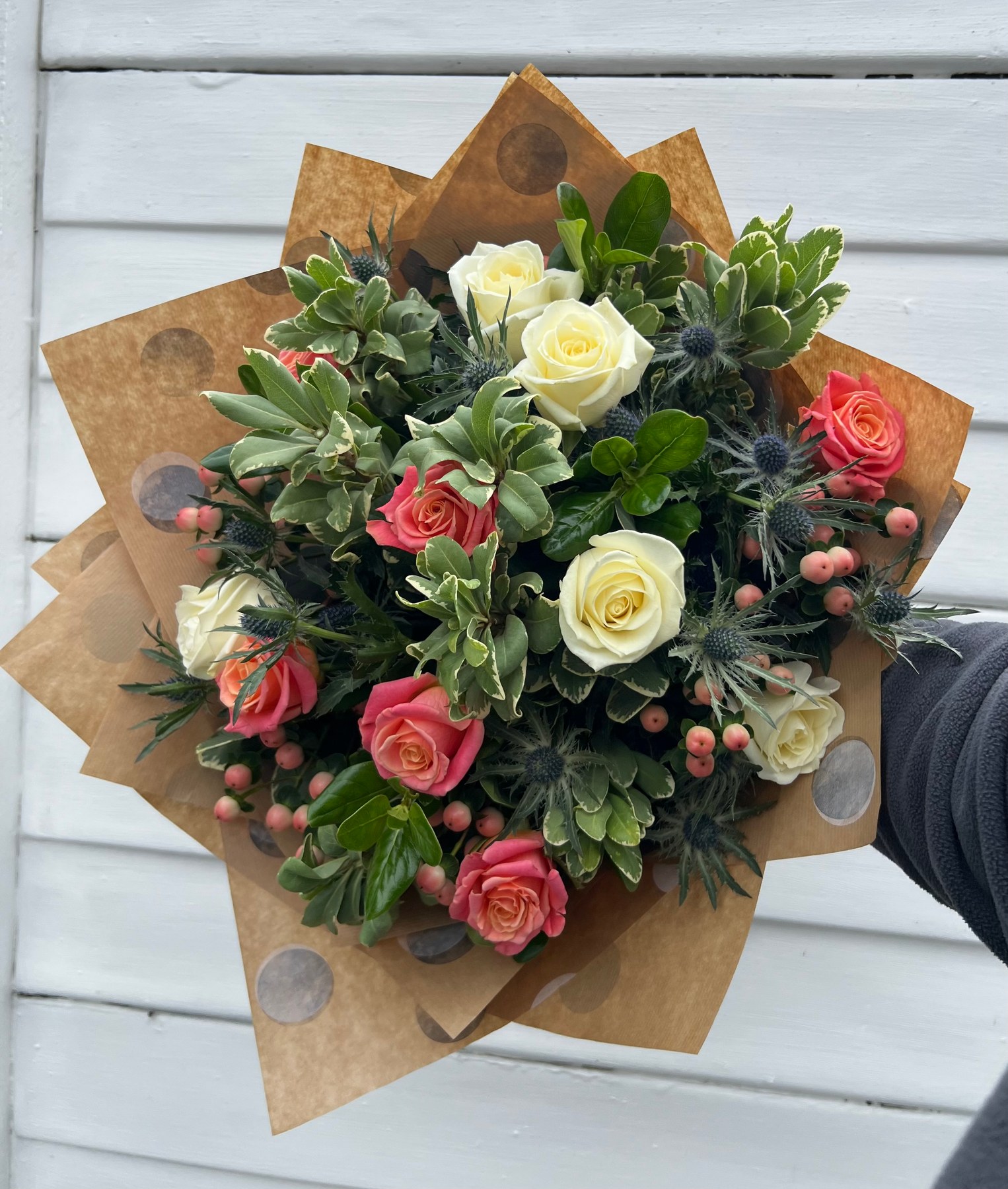 Bespoke pink and ivory rose bouquet with textured foliage
