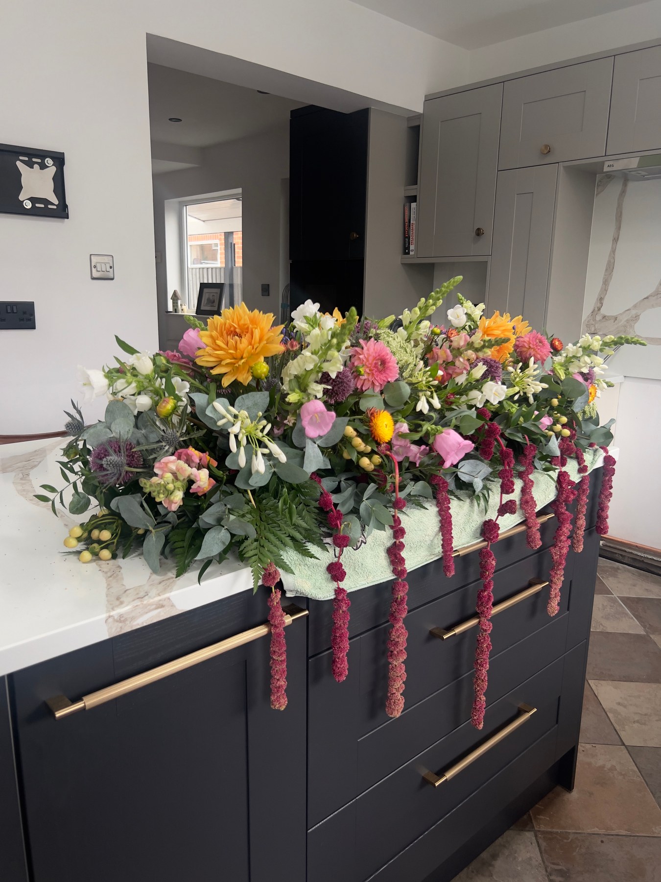 Colourful wedding flowers being prepared in the studio